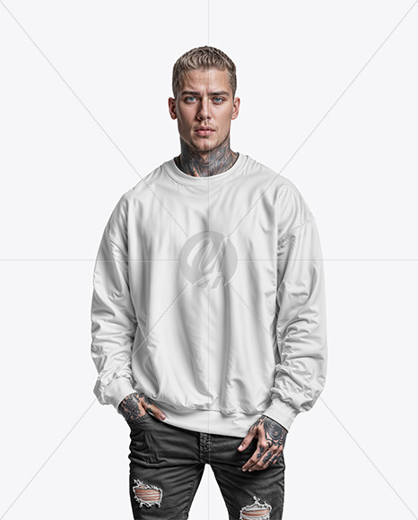 A Man with Tattoos Wearing an Oversize Sweatshirt and Jeans Mockup
