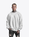 A Man with Tattoos Wearing an Oversize Sweatshirt and Jeans Mockup