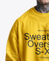A Man with Tattoos Wearing an Oversize Sweatshirt and Jeans Mockup