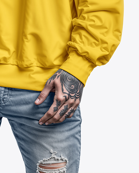 A Man with Tattoos Wearing an Oversize Sweatshirt and Jeans Mockup