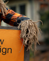 Halloween Scarecrow Holding a Sign Mockup