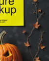 Poster on a Wall with Branches and Pumpkins Mockup