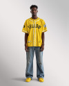 A Black Man Wearing a Baseball Jersey and Wide Jeans Mockup