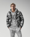 A Man Wearing a Puffer Jacket and a Hoodie Mockup