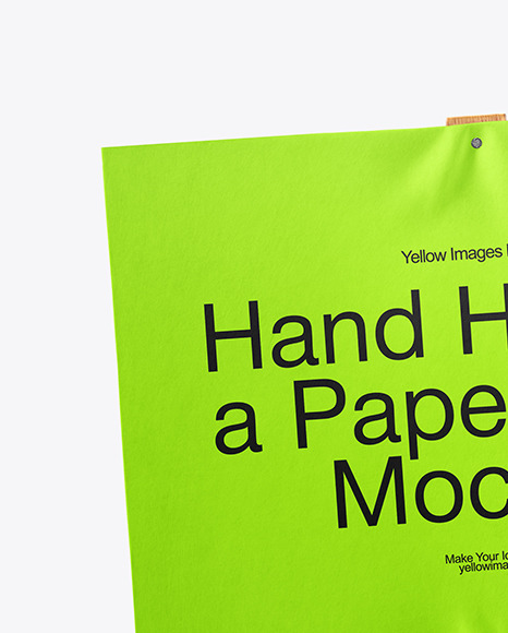 A Hand Holding a Paper Sign with Wooden Handle Mockup
