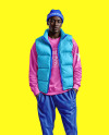 A Man Wearing a Puffer Vest with a Sweatshirt and Beanie Hat Mockup