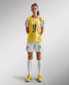 A Young Woman Wearing a Full Soccer Kit Mockup