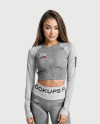 Woman Wearing a Long Sleeve Crop Top and Leggings Mockup