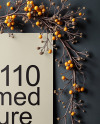 Poster on a Wall with Branches and Pumpkins Mockup
