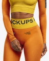 Woman Wearing a Long Sleeve Crop Top and Leggings Mockup