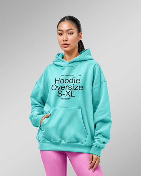 A Woman Wearing an Oversize Hoodie and Leggings Mockup