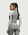 Woman Wearing a Long Sleeve Crop Top and Leggings Mockup
