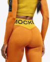 Woman Wearing a Long Sleeve Crop Top and Leggings Mockup
