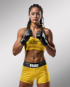 Female UFC Fighter with Pigtails Wearing Sports Bra and Shorts Mockup