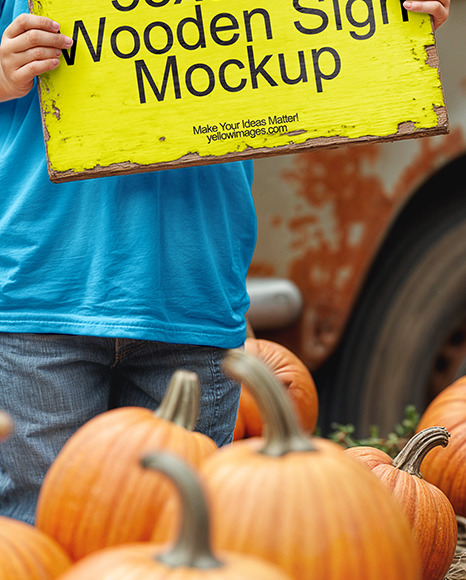 Boy Holding Wooden Sign Next to Truck at Pumpkin Patch Mockup