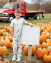 A Boy Leaned Hand on a Sign at a Pumpkin Patch Mockup