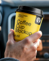 Two People in a Сar Holding Coffee Cups in Their Hands Mockup