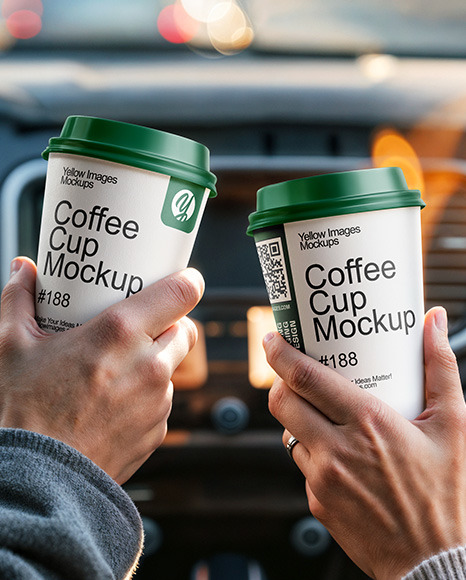Two People in a Сar Holding Coffee Cups in Their Hands Mockup