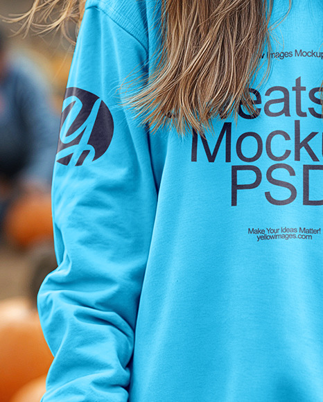 Young Woman in Sweatshirt Standing in a Pumpkin Patch Mockup