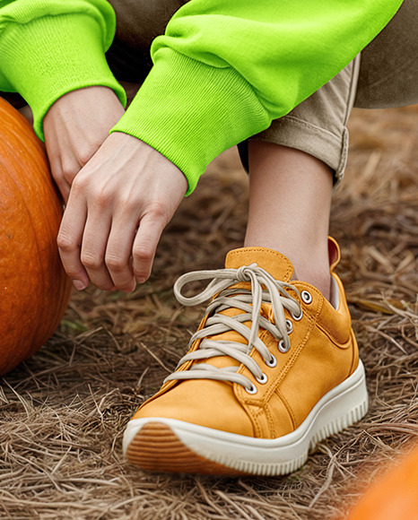 Young Woman in Sweatshirt and Beanie Sitting Next to Pumpkins Mockup