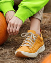 Young Woman in Sweatshirt and Beanie Sitting Next to Pumpkins Mockup