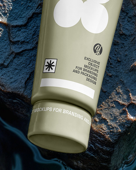 Cosmetic Tube on a Stone Surrounded by Water Mockup