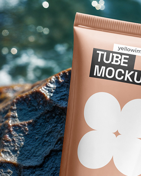 Cosmetic Tube on a Stone Surrounded by Water Mockup