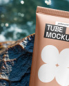 Cosmetic Tube on a Stone Surrounded by Water Mockup