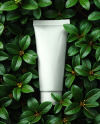 Matte Cosmetic Tube on Leaves Mockup