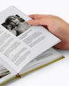 Opened Hardcover Book in a Hand Mockup - Half Side View