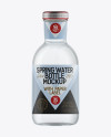 Clear Glass Spring Water Bottle with Paper Label Mockup