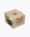 Clear Glass Sauce Jar in Kraft Paperboard Sleeve Mockup - Half Side View Clear Glass Sauce Jar in Kraft Paperboard Sleeve Mockup - Half Side View