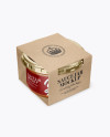 Clear Glass Sauce Jar in Kraft Paperboard Sleeve Mockup - Half Side View Clear Glass Sauce Jar in Kraft Paperboard Sleeve Mockup - Half Side View