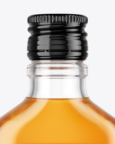 Clear Glass Bottle with Whisky Mockup