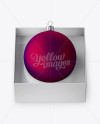 Matte Purple Christmas Ball in Paper Box Mockup (High-Angle Shot)