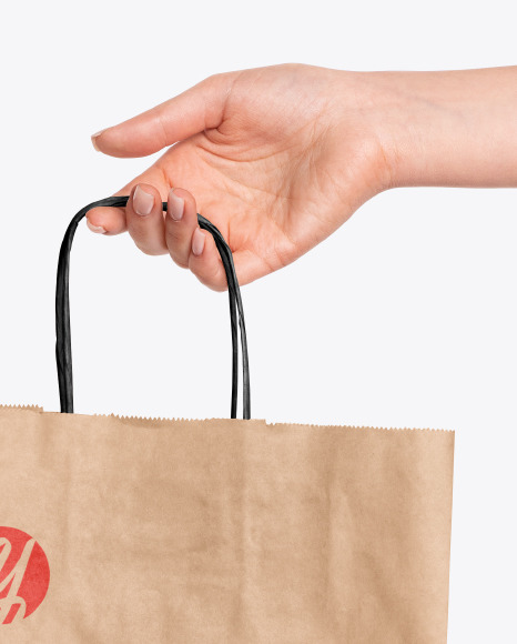 Hand Holding a Paper Bag Mockup