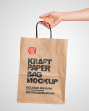 Hand Holding a Paper Bag Mockup