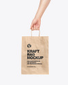 Hand w/ Paper Bag Mockup