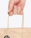 Hand w/ Paper Bag Mockup