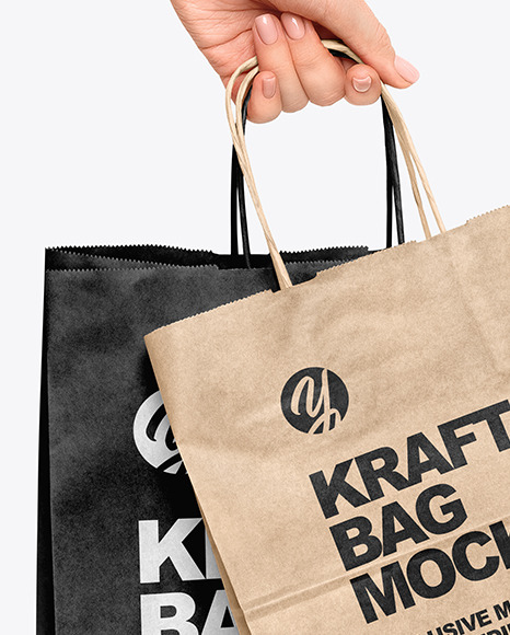 Hand w/ Two Paper Bags Mockup