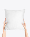 Pillow in Hands Mockup