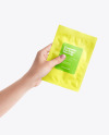 Sachet in a Hand Mockup