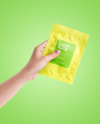 Sachet in a Hand Mockup