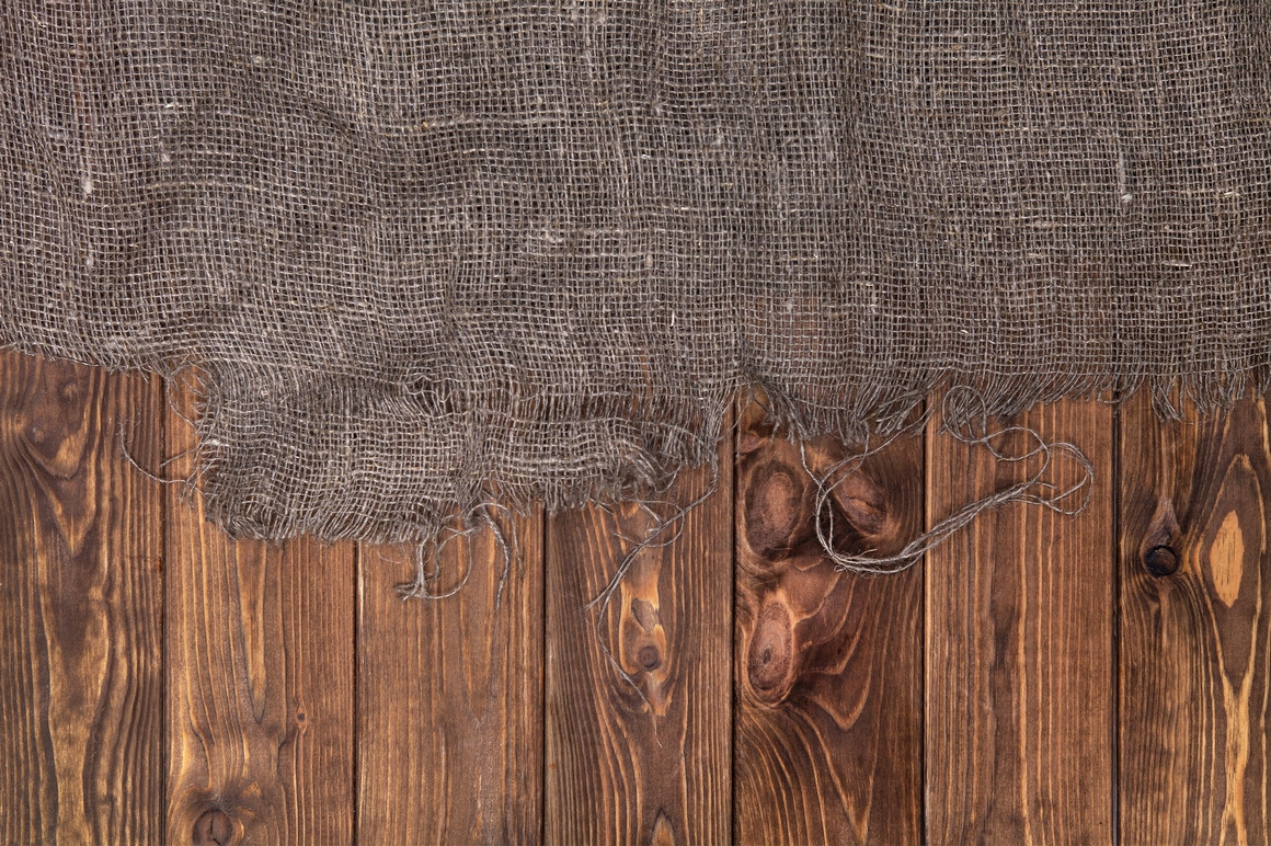 Rustic burlap on wooden table Rustic burlap on wooden table