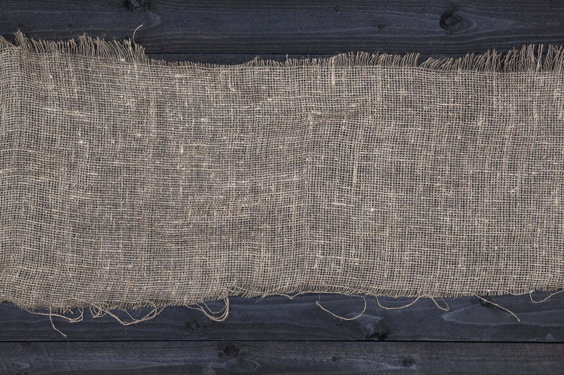 Rustic burlap on wooden table Rustic burlap on wooden table