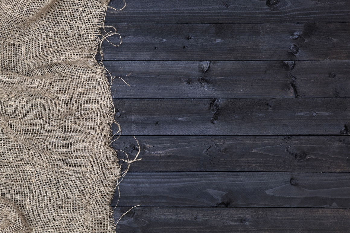 Rustic burlap on wooden table Rustic burlap on wooden table