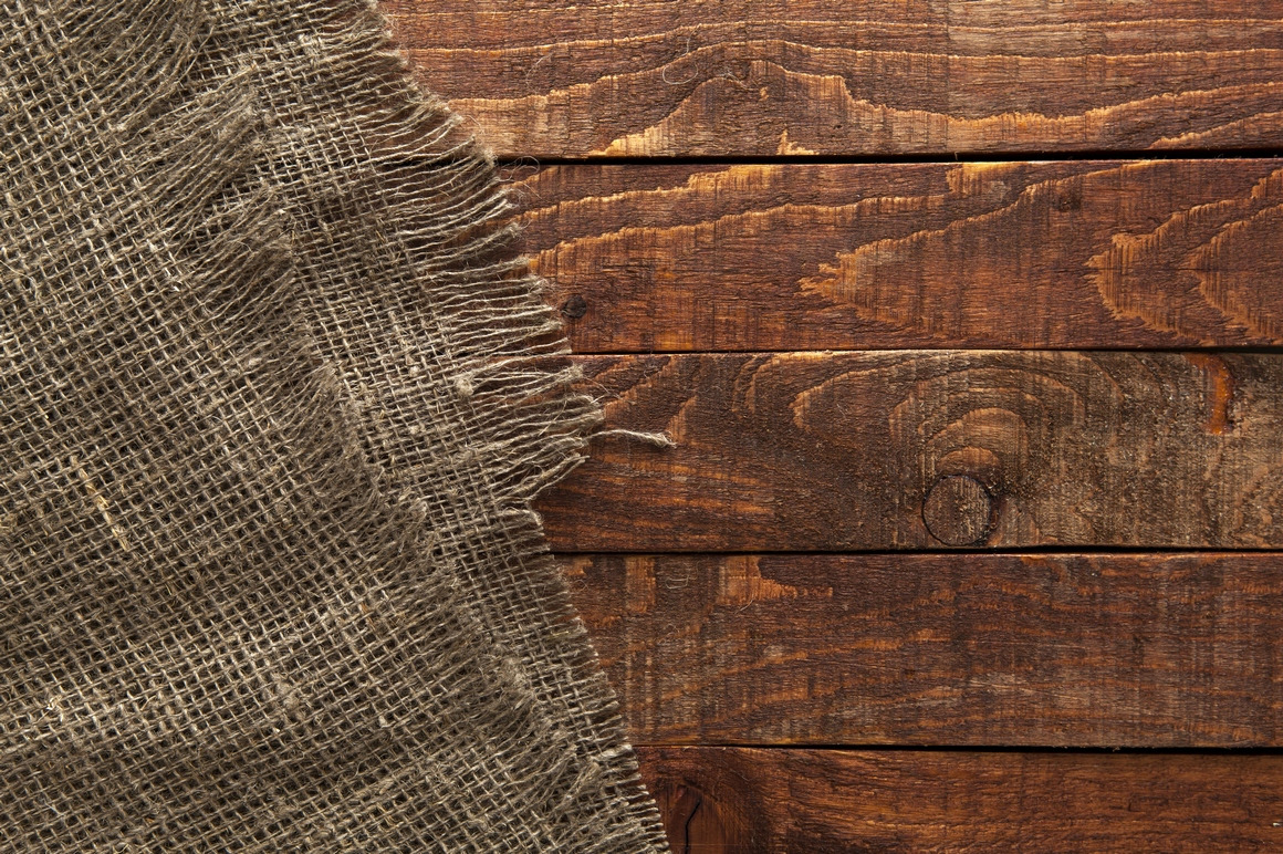 Rustic burlap on wooden table Rustic burlap on wooden table