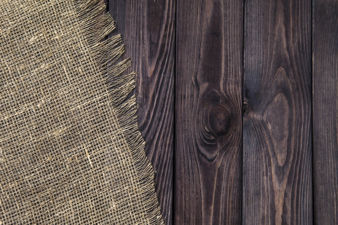 Rustic burlap on wooden table Rustic burlap on wooden table
