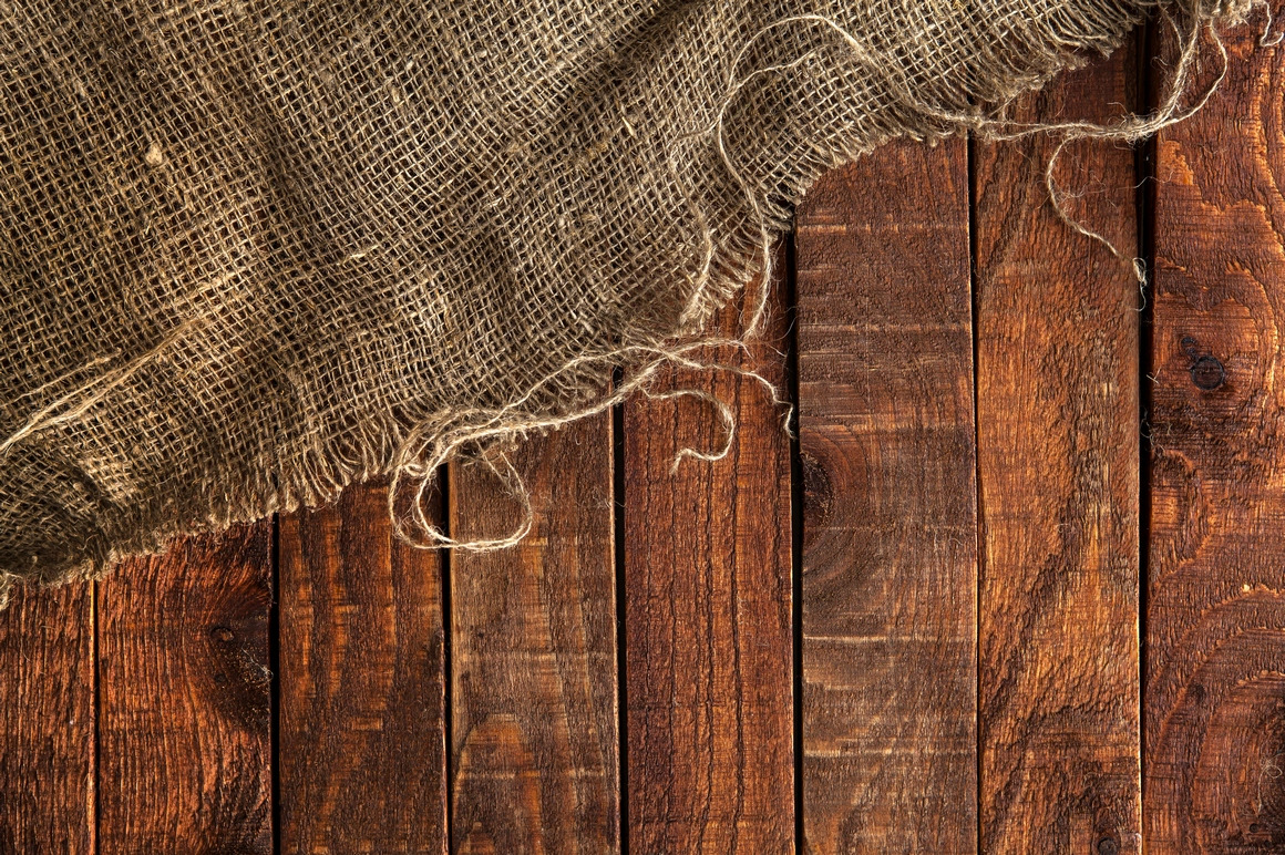 Rustic burlap on wooden table Rustic burlap on wooden table